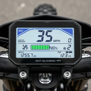A digital LCD display on the handlebar of a 48 volt electric dirt bike, showing speed, battery life, and other key metrics.