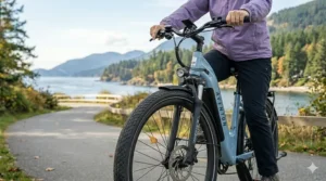 A close-up photograph of a wide, puncture-resistant e-bike tire with an aggressive stability tread, showcasing the feature designed to improve balance and dampens road vibrations for riders with arthritis.
