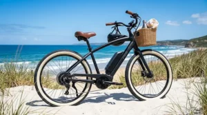 An electric beach cruiser bike with fat tires parked on white sand under a clear blue summer sky.
