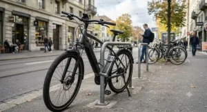 A commuter ebike with anti-theft lock parked on a busy city street.