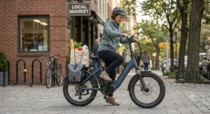 A shorter rider easily stepping through the frame of a loaded ebike carrying groceries on the rear rack.
