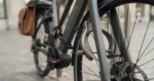 Close-up of the integrated locking mechanism on a theft-resistant urban electric bike.