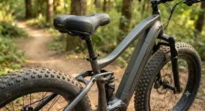 Detailed view of the comfortable seating and ergonomic frame geometry on a plus-size rider fat tire electric mountain bike.