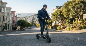 A rider climbing a steep hill effortlessly on a long-range electric scooter.