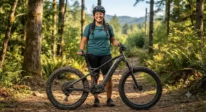 A happy plus-size rider standing outdoors next to their high-performance fat tire electric mountain bike ready for adventure.