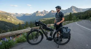 A rider stopping to enjoy a view while on a long journey with a reliable touring electric bike with a 100-mile range.