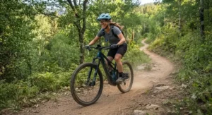 A beginner cyclist safely navigating a gentle dirt turn on a trail eMTB.