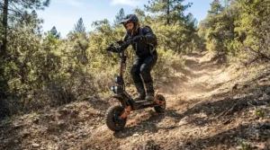 An off-road dual motor electric scooter hill climbing through a rocky dirt path in a scenic park.