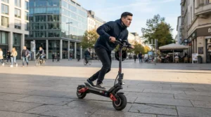 A rider accelerating quickly on a dual motor electric scooter equipped with an advanced power distribution system.