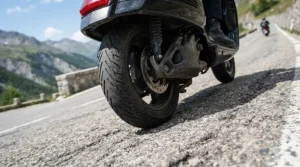 Demonstrating traction on slopes with a powerful dual motor electric scooter climbing a steep paved incline.