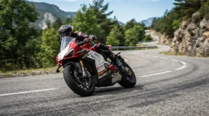 Demonstrating smooth moped-style handling while navigating a tight turn on a moped style electric scooter.