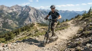 An adventurous rider navigating a steep mountain trail on an off road electric scooter.