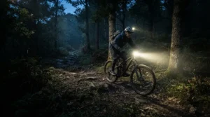 Bright LED headlights illuminating a dark path for an off road electric scooter under $1500 during dusk.