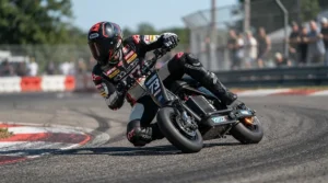 Rider wearing full track riding gear while leaning into a sharp turn on a racing electric scooter.
