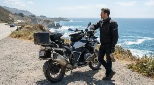 A sport rider parked at a scenic coastal viewpoint wearing a bluetooth helmet communicator for sport riders.