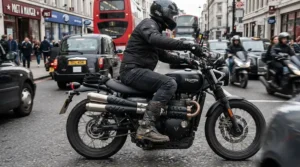 Agile urban rider wearing low profile short motorcycle riding boots for street fighter riders while navigating through dense traffic.